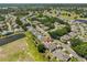 Aerial view of a neighborhood showcasing the homes and surrounding landscaping at 604 Mcdaniel St, Sun City Center, FL 33573