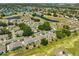 Aerial view of a residential community with lush greenery, winding streets, and scenic lakes at 604 Mcdaniel St, Sun City Center, FL 33573