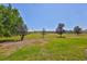 Enjoy this property’s peaceful backyard with mature trees and lush green space at 604 Mcdaniel St, Sun City Center, FL 33573