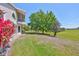 The property features a spacious yard with large trees and beautiful landscaping at 604 Mcdaniel St, Sun City Center, FL 33573