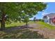 Expansive backyard with mature tree providing shade and a serene view at 604 Mcdaniel St, Sun City Center, FL 33573