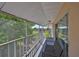 Screened balcony with outdoor seating and scenic views at 604 Mcdaniel St, Sun City Center, FL 33573