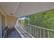 Relaxing view from a covered screened balcony with outdoor seating at 604 Mcdaniel St, Sun City Center, FL 33573