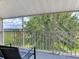 Balcony features outdoor seating with views of trees and sky at 604 Mcdaniel St, Sun City Center, FL 33573