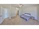 Spacious bedroom with neutral carpet and an ensuite bathroom entrance at 604 Mcdaniel St, Sun City Center, FL 33573