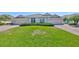 Charming home featuring a well-manicured lawn and a welcoming facade at 604 Mcdaniel St, Sun City Center, FL 33573