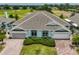 Charming single story home with a well-manicured lawn and attached two car garage at 604 Mcdaniel St, Sun City Center, FL 33573