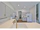 Well-lit kitchen featuring new appliances, stylish cabinetry and a large sink at 604 Mcdaniel St, Sun City Center, FL 33573