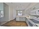 Bright kitchen features stainless appliances, granite countertops, and light wood flooring at 604 Mcdaniel St, Sun City Center, FL 33573