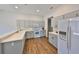 Bright kitchen with a center island, modern appliances, and ample counter space at 604 Mcdaniel St, Sun City Center, FL 33573