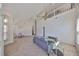 Open concept living room with high ceilings, a loft overlook, and modern decor at 604 Mcdaniel St, Sun City Center, FL 33573