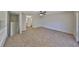 The second-floor loft features carpet flooring, and overlooks the first floor at 604 Mcdaniel St, Sun City Center, FL 33573