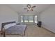 Large primary bedroom with a ceiling fan and a picturesque bay window at 604 Mcdaniel St, Sun City Center, FL 33573