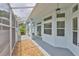 Cozy covered patio with screened in windows and comfortable outdoor space at 604 Mcdaniel St, Sun City Center, FL 33573