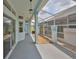 Relaxing outdoor patio area with screen enclosure for enjoying pleasant weather at 604 Mcdaniel St, Sun City Center, FL 33573