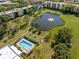 Gorgeous aerial view of the condo community featuring a swimming pool and lake at 6070 80Th N St # 104, St Petersburg, FL 33709