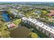 Gorgeous aerial view of the condo community featuring beautiful lake views at 6070 80Th N St # 104, St Petersburg, FL 33709