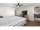 Comfortable bedroom featuring a ceiling fan and wood flooring at 6070 80Th N St # 104, St Petersburg, FL 33709