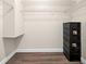 Walk-in closet features laminate flooring and white wire shelving at 6070 80Th N St # 104, St Petersburg, FL 33709