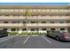Charming condo building featuring multiple floors and a well-manicured landscape with parking at 6070 80Th N St # 104, St Petersburg, FL 33709