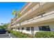 Charming condo building featuring multiple floors and a well-manicured landscape at 6070 80Th N St # 104, St Petersburg, FL 33709
