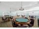 Bright community game room featuring tables, chairs, and ample space for residents to enjoy games at 6070 80Th N St # 104, St Petersburg, FL 33709