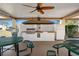 Outdoor community grill area featuring a stainless steel grill and picnic tables for gatherings at 6070 80Th N St # 104, St Petersburg, FL 33709