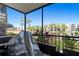 Screened patio with a view of the pond and neighboring buildings at 6070 80Th N St # 104, St Petersburg, FL 33709