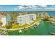 Amazing aerial view of condo complex with boat docks and a resort-style community pool at 610 Island Way # 302, Clearwater Beach, FL 33767
