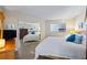 Mirrored bedroom with view of the bed, closet, and a window at 610 Island Way # 302, Clearwater Beach, FL 33767