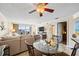 Comfortable living room with balcony access, view of waterfront, and adjacent dining area at 610 Island Way # 302, Clearwater Beach, FL 33767