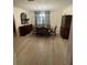 Elegant dining room features modern vinyl floors and lovely window views at 7006 41St E Ave, Bradenton, FL 34208