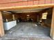 View of the garage, showing the interior with a concrete floor and wooden walls at 7006 41St E Ave, Bradenton, FL 34208