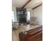 Bright living room features a stone fireplace, neutral walls and comfortable furnishings at 7006 41St E Ave, Bradenton, FL 34208