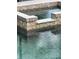 Inviting pool with a spa featuring decorative tile and clear, refreshing water at 7006 41St E Ave, Bradenton, FL 34208