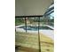 Screened-in pool with a spa, concrete surround, and a newly built wooden deck at 7006 41St E Ave, Bradenton, FL 34208