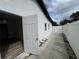 Backyard with white fence and back door to property at 7608 Lakeside Blvd, Tampa, FL 33614