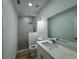 Stylist bathroom with modern shower featuring marble accents and a glass enclosure at 7608 Lakeside Blvd, Tampa, FL 33614