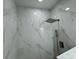 Modern bathroom features elegant, large white marble tiles in the shower at 7608 Lakeside Blvd, Tampa, FL 33614