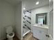 Modern bathroom with a shower, white vanity, and bright overhead lighting at 7608 Lakeside Blvd, Tampa, FL 33614