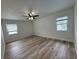 Spacious bedroom with large windows offering a view of the pool at 7608 Lakeside Blvd, Tampa, FL 33614