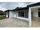 Beautifully updated home featuring a covered parking area and a welcoming entrance at 7608 Lakeside Blvd, Tampa, FL 33614