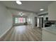 Open-concept living room featuring lots of natural light and new flooring at 7608 Lakeside Blvd, Tampa, FL 33614