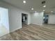 Open concept living room features wood floors and recessed lighting at 7608 Lakeside Blvd, Tampa, FL 33614