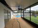 Spacious screened in lanai features a ceiling fan, and overlooks the sparkling pool and landscaped backyard at 7608 Lakeside Blvd, Tampa, FL 33614