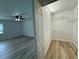 Organized walk-in closet with white wire shelving and light wood flooring at 7608 Lakeside Blvd, Tampa, FL 33614