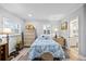 Bedroom features a dresser, side tables, and luxury vinyl plank flooring at 7912 3Rd S Ave, St Petersburg, FL 33707