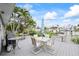 Waterfront deck with outdoor seating and lush surroundings at 7912 3Rd S Ave, St Petersburg, FL 33707