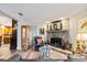 Cozy living room features a stone fireplace, curated furnishings, and natural light at 7912 3Rd S Ave, St Petersburg, FL 33707