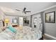 Bright main bedroom features an ensuite bathroom and sliding glass door to outdoor patio at 7912 3Rd S Ave, St Petersburg, FL 33707